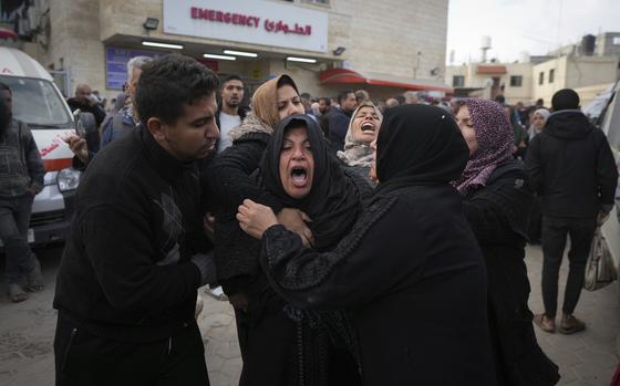 Palestinians mourning after a bombardment.