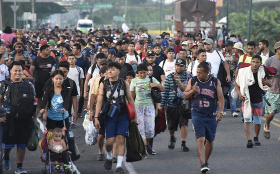 Migrants walk along the highway through Suchiate, Chiapas state in southern Mexico, July 21, 2024, during their journey north toward the U.S. border.