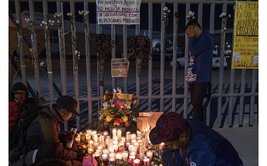 Migrant Jose Perez, right, from Venezuela, reacts during a vigil outside Mexican immigration facilities where at least 38 migrants died in a fire, in Ciudad Juarez, Chihuahua state, Mexico, on March 28, 2023. 