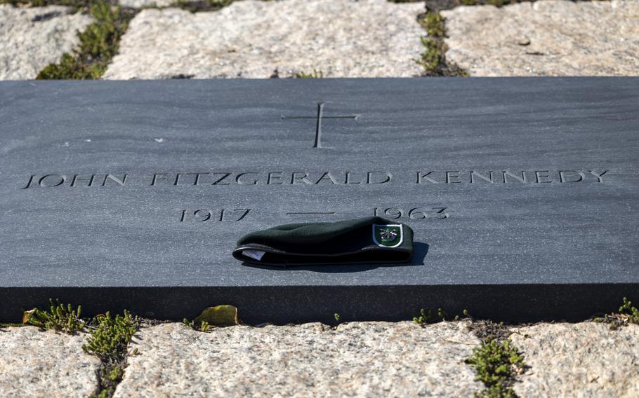 A beret laid on the headstone for President John F. Kennedy, Thursday, Oct. 17, 2024 at Arlington National Cemetery in Arlington, Va.