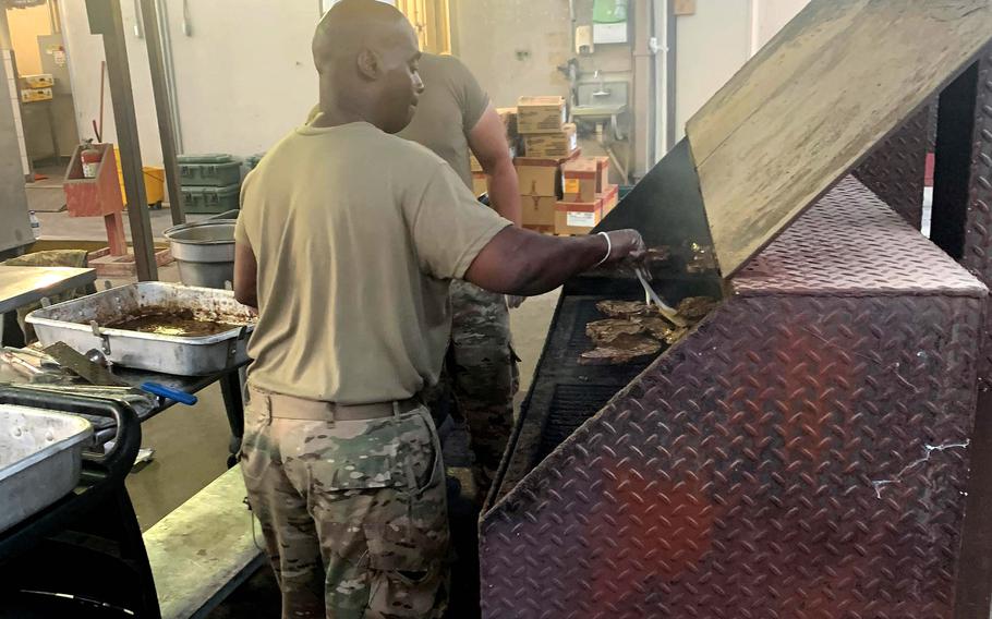 Army Reserve Master Sgt. Lloyd Cossey, deployed to Camp Arifjan, Kuwait, with the Indianapolis-based 310th Sustainment Command (Expeditionary), grills steaks at the North Dining Facility at Bagram Airfield, Afghanistan, during his 29-day assignment there that ended July 2, 2021, as the base closed. 