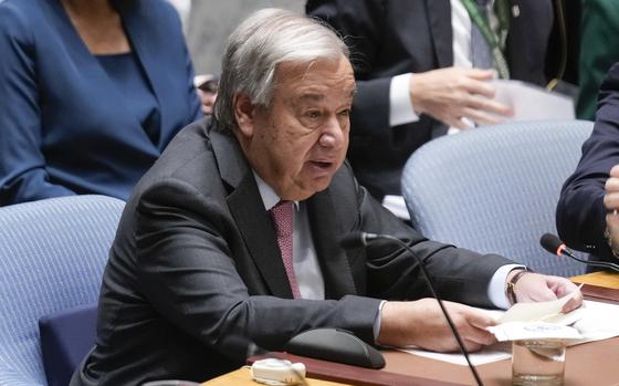 U.N. Secretary-General Antonio Guterres speaks while seated at a desk during a Security Council meeting.