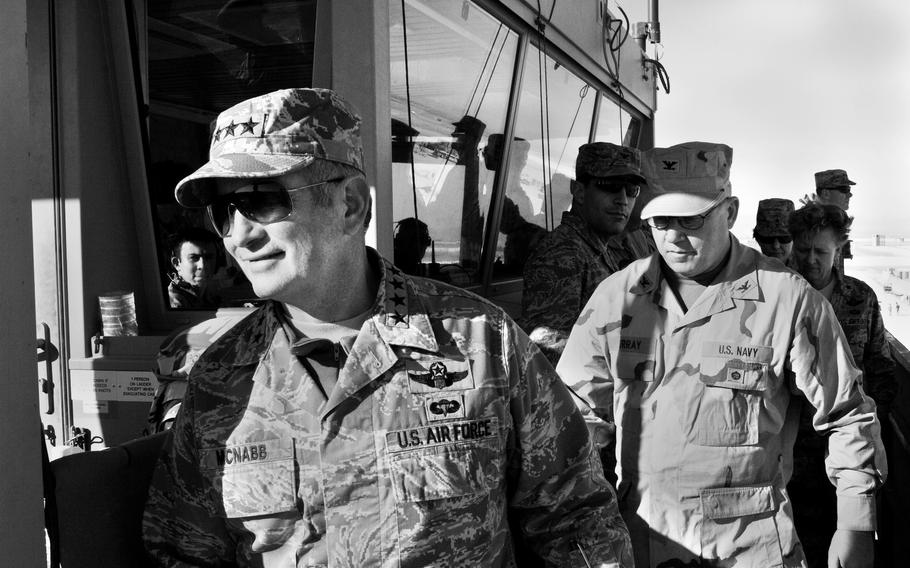 Gen. Duncan McNabb, left, commander of Transcom, tours the control tower at Camp Bastion, in Helmand province, Afghanistan, in January 2010.