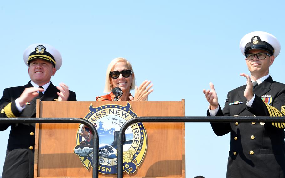 Steven Halle, Dr. Susan DiMarco, Joseph Calhoun, chief of the boat applaud