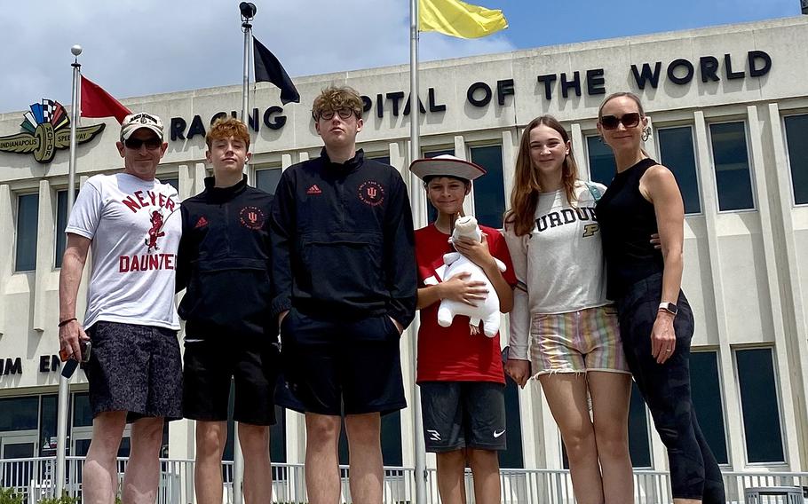 The Arnold family, from left, Eric, Hunor and Nandor Arnold, Alec Martinez and Lucia Martinex, and Jenny Arnold pose for a photo at Indianapolis Motor Speedway in Indianapolis. The Arnolds will catch two medal matches — volleyball and water polo — and canoe races on the last weekend of the Paris Olympics on Aug. 9-11.