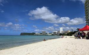 The view from Matapang Beach Park in Tumon, Guam, is flanked by the cliffs of Harmon Village. 