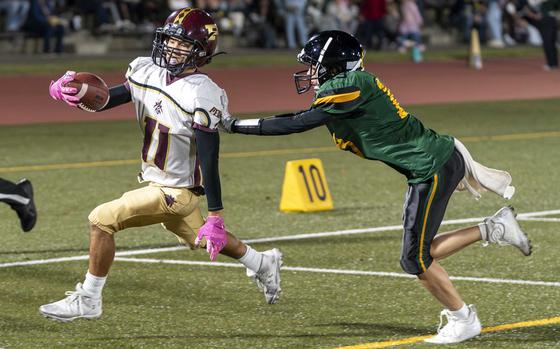 Perry's Kameron Ramos outruns Edgren's Ren Dick into the end zone for the game's first touchdown.