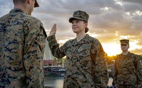 U.S. Marine Corps Master Sgt. Sarah Nadeau recites the oath of enlistment during a ceremony at Larrakeyah Barracks in Australia on April 23, 2021. Eligible senior enlisted Marines will now be able to apply for reenlistment that lasts until the end of their rank's respective service limitations. 