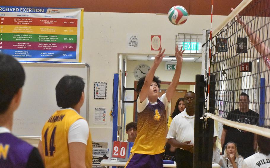 Bahrain’s Jacob Courts pushes the ball over the net in a match against Naples on Thursday, Oct. 26, 2023, at the DODEA-Europe boys volleyball championships.