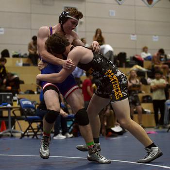 Kydan Echard and Andrew Morrow grapple.