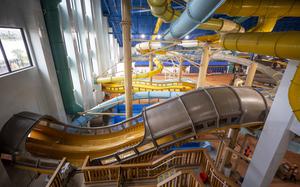 Great Wolf Lodge in Naples’ 92,000-square-foot water park features 12 slides, multiple pools, a lazy river and water play areas, some of which can be seen above during a construction tour on Aug. 22. 