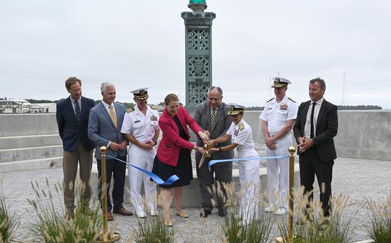 Assistant Secretary of the Navy Meredith Berger, Secretary of the Navy Carlos Del Toro and Naval Academy Superintendent Vice Adm. Yvette M. Davids cut the ribbon. The Naval Academy celebrated the completion of the Farragut Sea Wall with a ribbon cutting ceremony Friday morning. (Paul W. Gillespie/Staff photo)