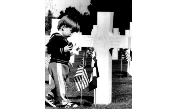 Colleville-sur-Mer, France, June 4, 1984: At the U.S. cemetery overlooking the D-Day beaches, two-year-old Tommy Daniel, son of Capt. Timothy and Carol Daniel, stands at the grave of an American soldier killed during the World War II invasion of Normandy.

Check out what will be happening on the Normandy beaches this year for D-Day's 80th anniversary on our Europe Community paper's D-Day page here.
https://europe.stripes.com/d-day/

META TAGS: DDAY80; Normandy; D-Day; WWII; World War II