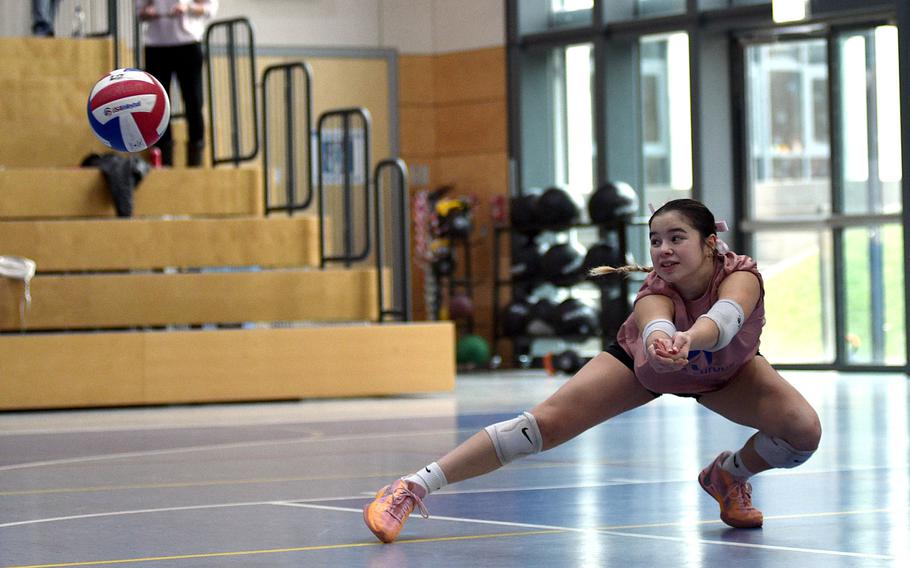 Ramstein libero Emma Ithavixay of the Gold team watches the ball after she dug it out during the 2024 DODEA-Europe All-Star volleyball matches on Nov. 9, 2024, at Ramstein High School on Ramstein Air Base, Germany.