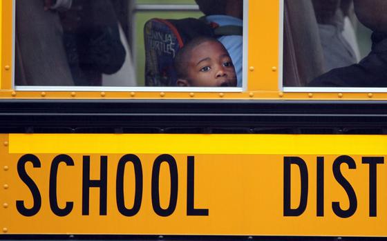 Students arrive at Harvey Rice Elementary School in Cleveland on their first day of school on Wednesday, Aug. 13, 2014. (Lisa DeJong/The Plain Dealer)