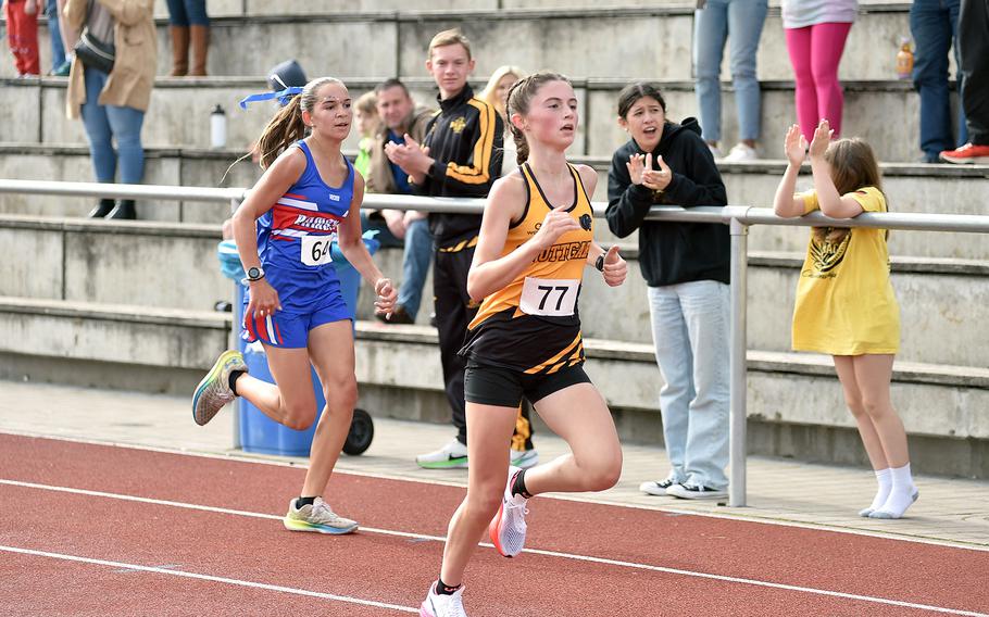 Stuttgart junior Pacha Miletich sprints to the finish line ahead of Ramstein's Rose Thompson during a cross country meet on Sept. 14, 2024, at Ramstein High School on Ramstein Air Base, Germany.