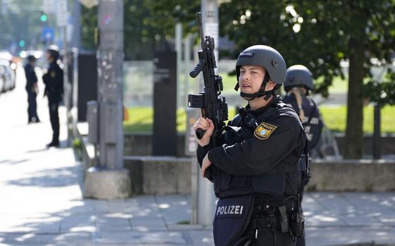 Police officers patrol near a scene after police fired shots at a suspicious person near the Israeli Consulate and a museum on the city's Nazi-era history in Munich, Germany, Thursday, Sept. 5, 2024. (AP Photo/Matthias Schrader)