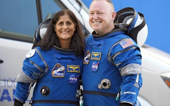 FILE - NASA astronauts Suni Williams, left, and Butch Wilmore stand together for a photo enroute to the launch pad at Space Launch Complex 41 Wednesday, June 5, 2024, in Cape Canaveral, Fla., for their liftoff on the Boeing Starliner capsule to the international space station. (AP Photo/Chris O'Meara, File)