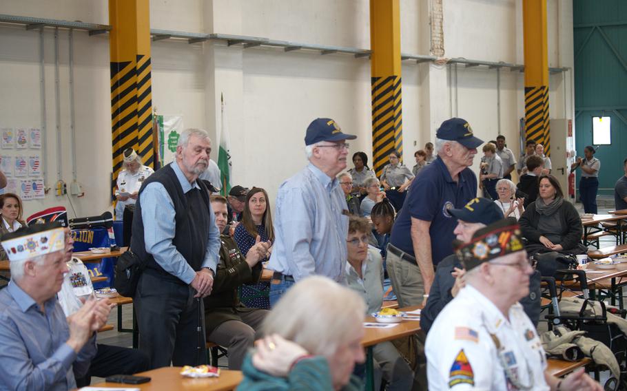 Vietnam War veterans stand up to be recognized.