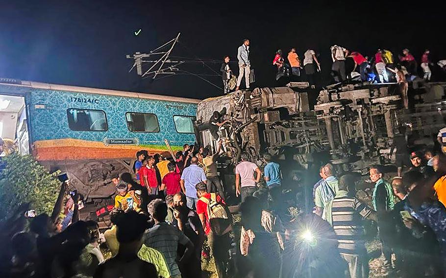 Rescuers work at the site of passenger trains that derailed in Balasore district, in the eastern Indian state of Orissa, Friday, June 2, 2023. Two passenger trains derailed in India, killing at least 13 people and trapping hundreds of others inside more than a dozen damaged coaches, officials said. About 400 people were injured and taken to hospitals, and the cause of the accident was under investigation, officials said.