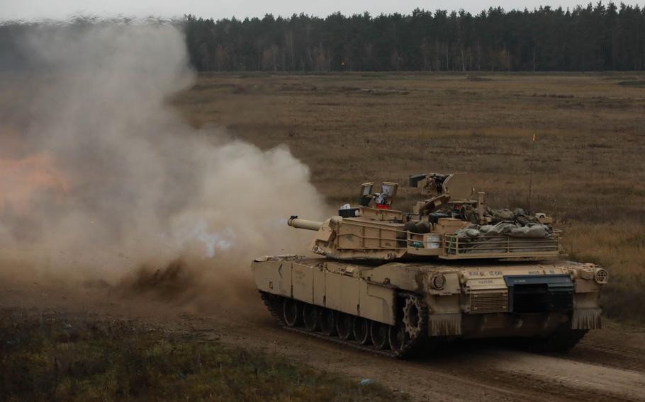 Smoke fills the air after a simulated strike from a tank.