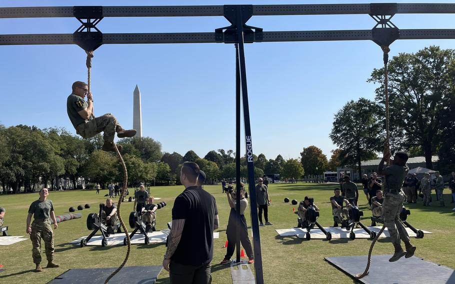 Two soldiers from the 10th and 11th squads climb ropes during the Army Best Squad Fitness Event in Washington, D.C., Oct. 12, 2024.