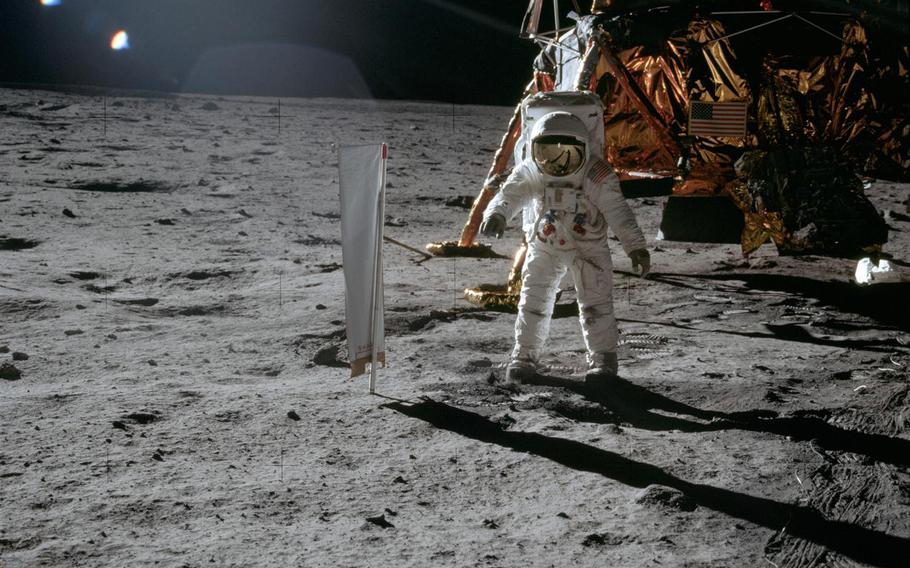 A U.S. astronaut on the moon, in front of a lunar lander, July 20, 1969.