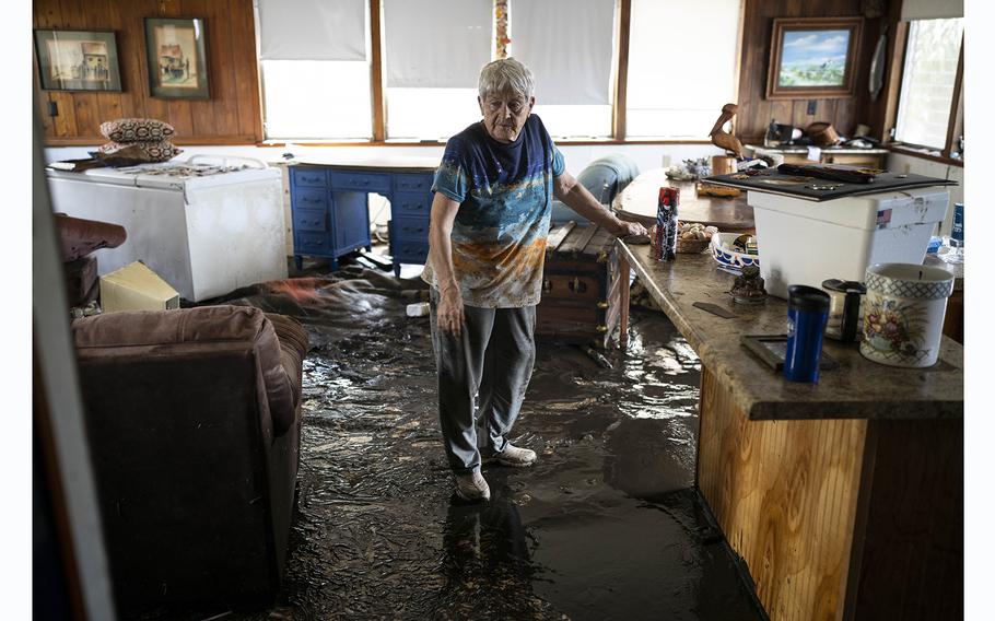 Bobbi Pattison in her damaged home, where cleanup was underway after Hurricane Idalia struck in Steinhatchee, Florida.