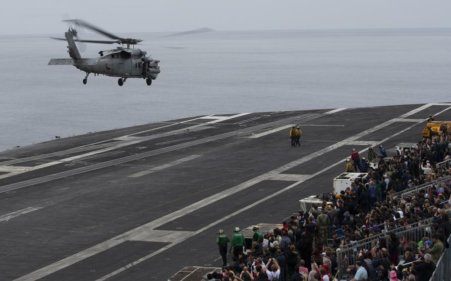 Guests aboard USS Carl Vinson for a Family and Friends Day Cruise watch an airpower demonstration on the flight deck on Saturday, Aug. 17, 2024. 