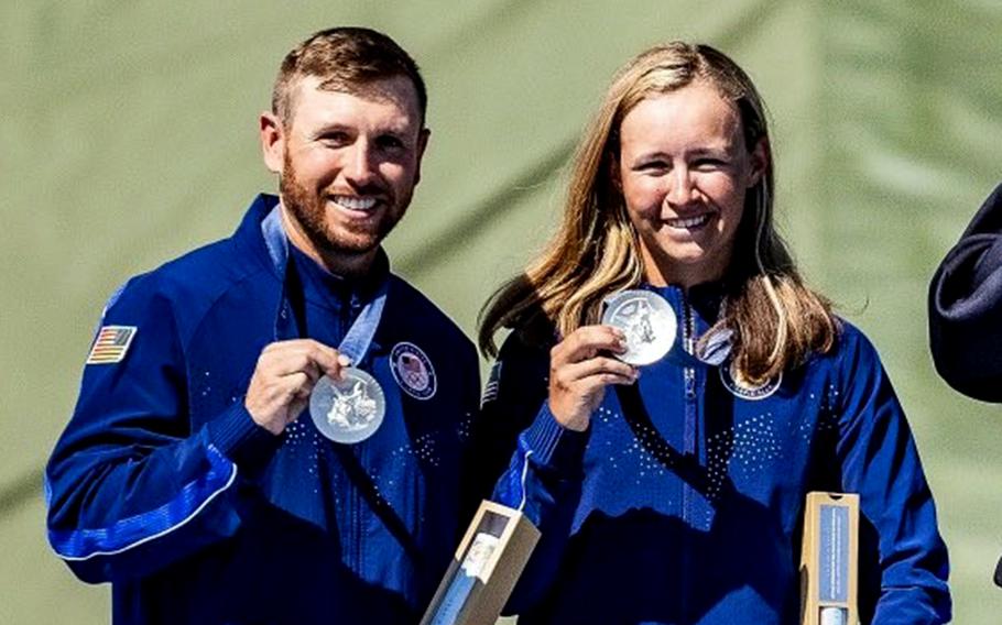 Vincent Hancock and Austen Smith show off their silver medals after taking second place in thein mixed team skeet at the 2024 Paris Olympics, Monday, Aug. 5, 2024.