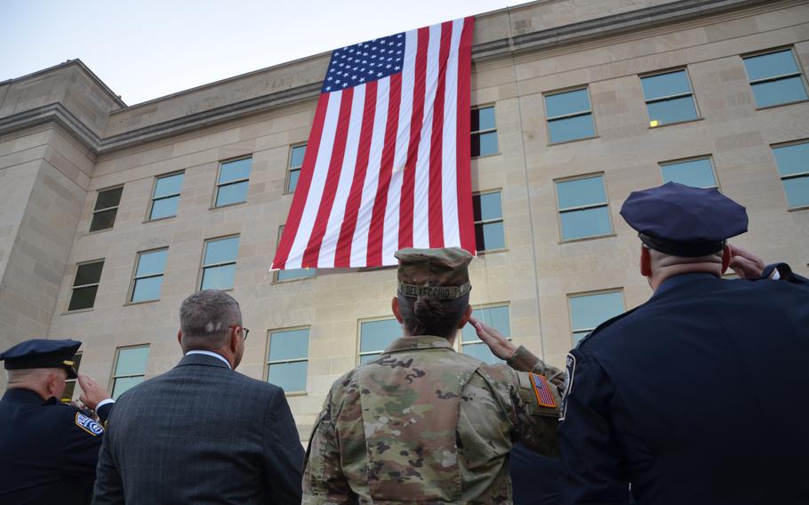 A flag is unfurled at the Pentagon for an observance ceremony on Wednesday, Sept. 11, 2024.