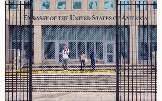 Workers at the U.S. Embassy in Havana leave the building on Sept. 29, 2017, after the State Department announced that it was withdrawing all but essential diplomats from the embassy. (Emily Michot/Miami Herald/TNS)