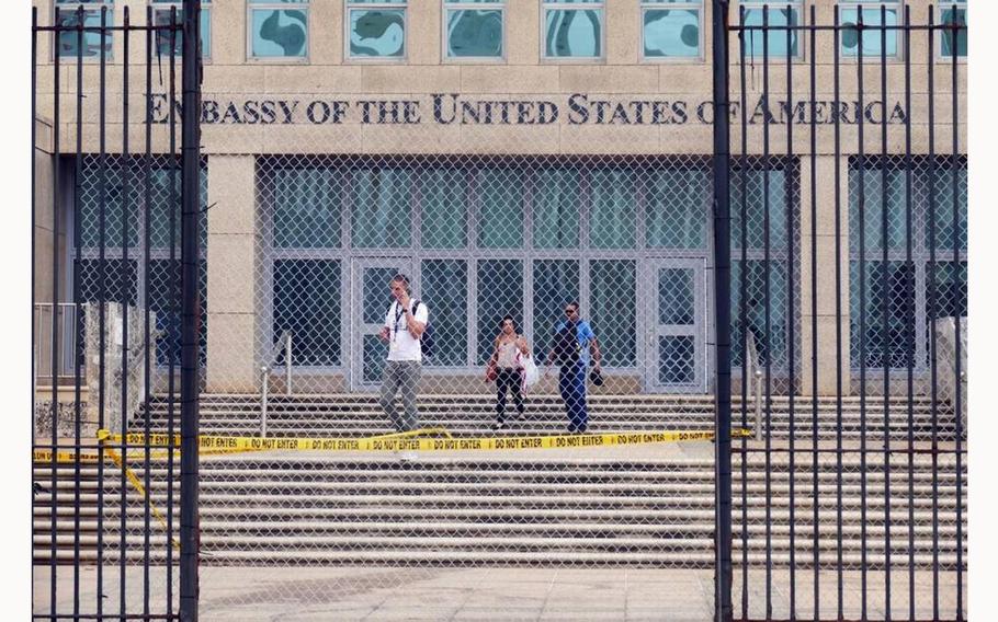 Workers at the U.S. Embassy in Havana leave the building on Sept. 29, 2017, after the State Department announced that it was withdrawing all but essential diplomats from the embassy. 