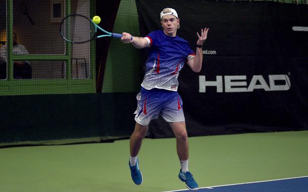 Ramstein senior Tristan Chandler jumps as he hits the ball during the boys singles final against Vicenza's Michael Gillett during the DODEA European tennis championships on Oct. 26, 2024, at T2 Sports Health Club in Wiesbaden, Germany.