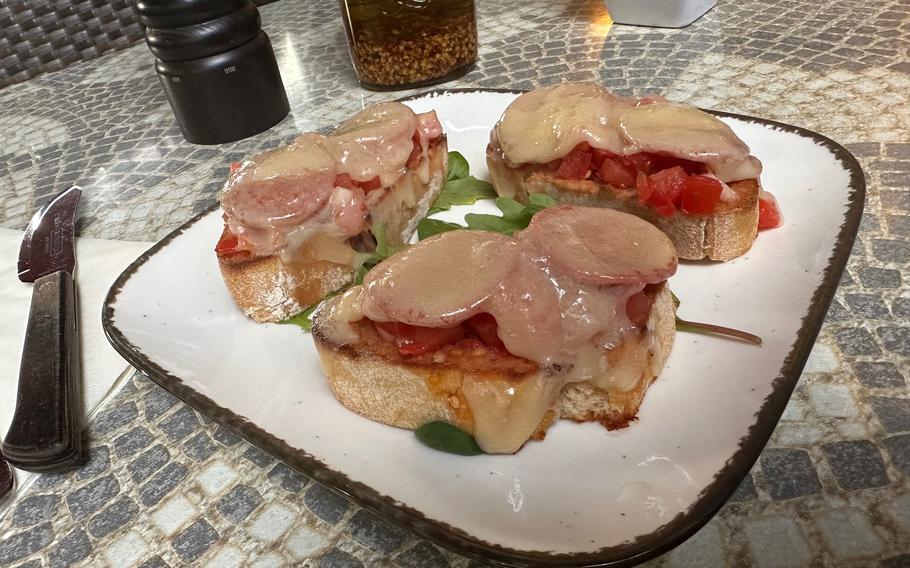 Bruschetta della casa at Osteria La Toscana restaurant in Weiden, Germany, June 16, 2023. Diners can find a wide range of starters on the restaurant's menu, which is offered in English. 