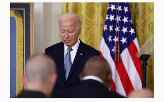 U.S. President Joe Biden listens during a prayer at a Medal of Honor ceremony in the East Room of the White House on July 3, 2024, in Washington, D.C. Biden presented the awards posthumously to two Union U.S. soldiers Philip Shadrach and George Wilson who fought during the Civil War and participated in an undercover mission later known as the “Great Locomotive Chase.”  (Alex Wong/Getty Images/TNS)