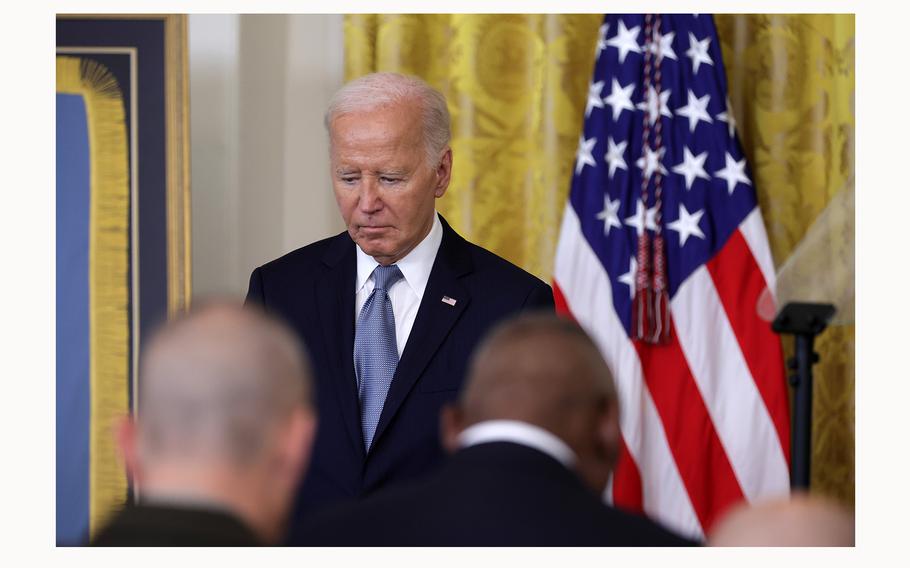 President Joe Biden listens during a prayer at a Medal of Honor ceremony in the East Room of the White House on July 3, 2024, in Washington, D.C. 