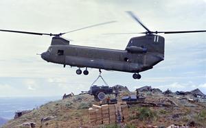 A U.S. Army CH-47 Chinook lowers a water trailer to a hilltop camp in Tam Ky, Vietnam, in September 1967.