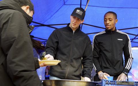 American troops team up with local church to feed homeless people in ...