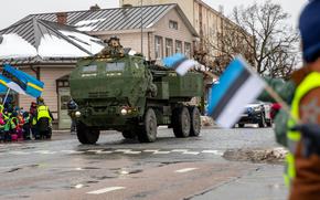 A U.S. Army M142 High Mobility Artillery Rocket System is greeted by Estonian children waving and cheering as it rolls down the street during a parade in Rakvere, Estonia, Jan. 16, 2025. Estonia has taken delivery of its first HIMARS launchers, after they were handed over at a Lockheed Martin plant in Arkansas on Jan. 13, and are expected to arrive in the Baltic country in the coming months.