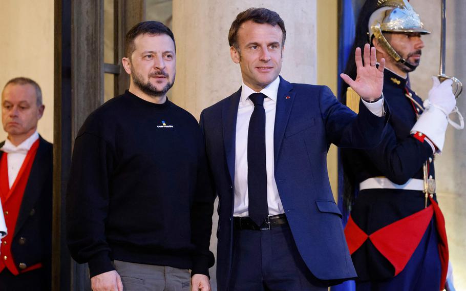 Ukraine's President Volodymyr Zelenskyy is welcomed by France's President Emmanuel Macron upon his arrival at the Elysee presidential palace in Paris on Sunday, May 14, 2023. Training troops inside Ukraine has been one of the options discussed since a conference that Macron convened in Paris in February 2024, according to a French defense ministry official.