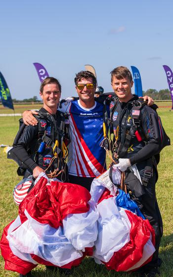 Sgt. 1st Class Michael Connors, Sgt. 1st Class Mitch Stockenberg, and Sgt. 1st Class Jeshua Stahler of the U.S. Army Parachute Team pose for a picture