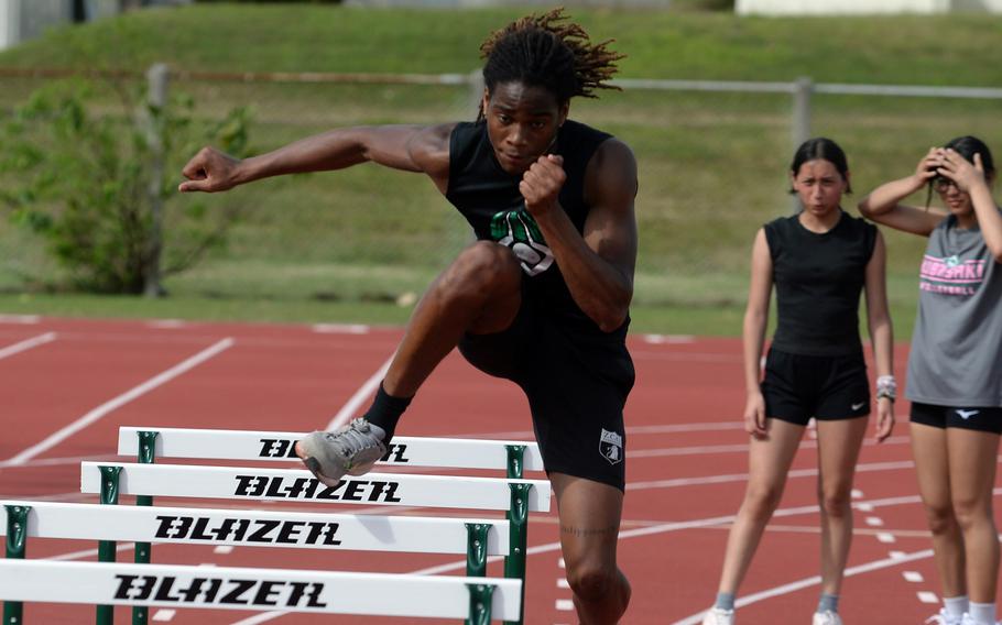 Carlos Cadet practices on the hurdles.