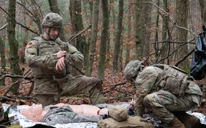 Sgt. Andrew Villegas, left, and Cpl. Billy Wiggins, combat medics assigned to the 52nd Air Defense Artillery Brigade, participate in the Europe Best Medic Competition in Landstuhl, Germany, Dec. 11, 2024.