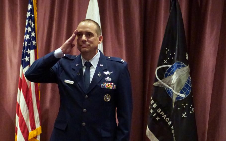 Col. Ryan Laughton salutes during the unit’s activation ceremony.