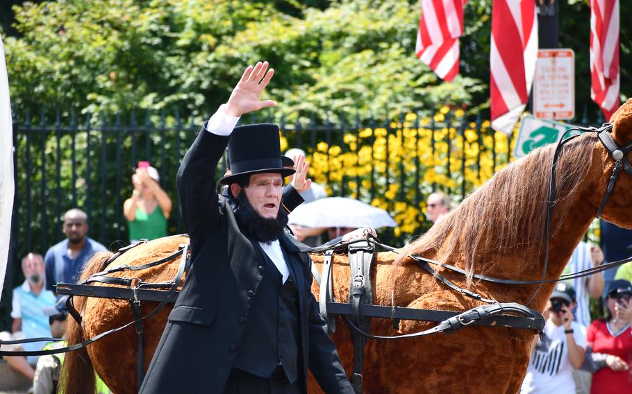 Abraham Lincoln stands on a float in Washington, D.C.’s July 4th parade.