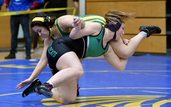 Naples' Audrey Pounds twirls SHAPE's Ilaria Chierchia during a 155-pound pool-play match at the 2025 DODEA European wrestling championships on Feb. 6, 2025, at the Wiesbaden Sports and Fitness Center on Clay Kaserne in Wiesbaden, Germany.