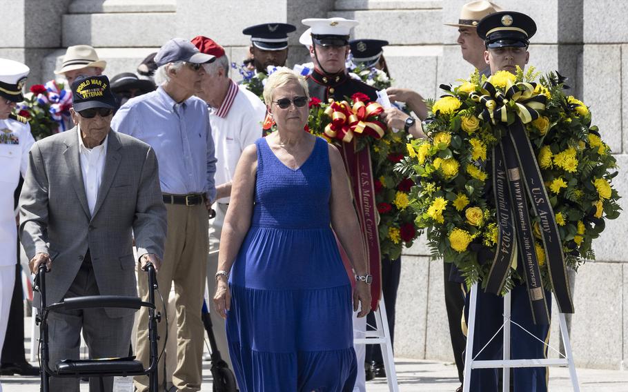 Veteran Frank Cohn, and Melissa Durbin (granddaughter of veteran Roger Durbin) plcae a wreath at the 20th anniversary celebration of the National World War II Memorial in Washington, May 25, 2024.