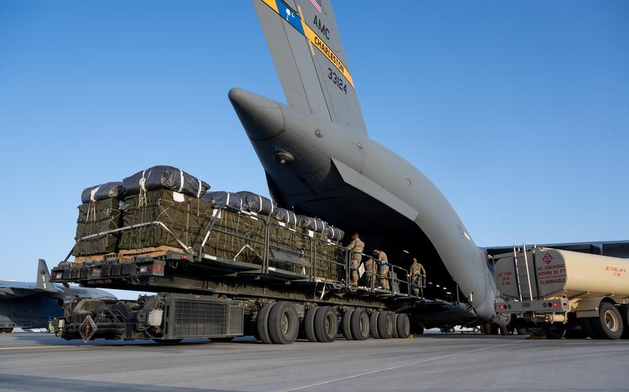 Crates are loaded onto a C-17 Globemaster III.