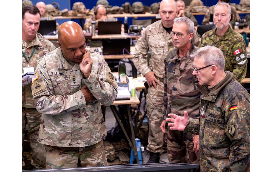 German Col. Michael Von Block, front right, briefs Gen. Darryl A. Williams, U.S. Army Europe and Africa commander, during Exercise Avenger Triad 24 at deployed headquarters Allied Rapid Reaction Corps element in the United Kingdom on Sept. 15, 2024.